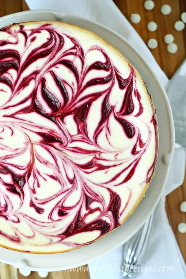 White Chocolate Raspberry Swirl Cheesecake | Let's Dish Recipes #dessert #cheesecake #recipe