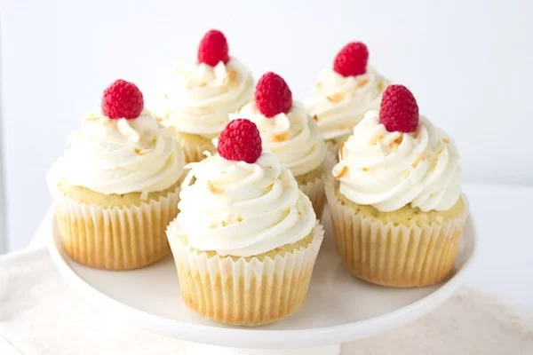 Coconut Cupcakes with Raspberry Filling #cupcakes #dessert #snack #food #recipe