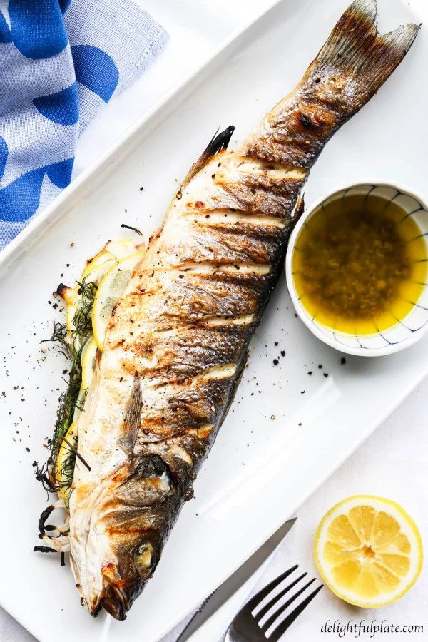 Grilled whole Branzino with Lemon Caper Sauce #grilled #fish #grill #dinner #recipe